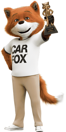 The Carfax Car Fox holding the 2025 Golden Car Fox award